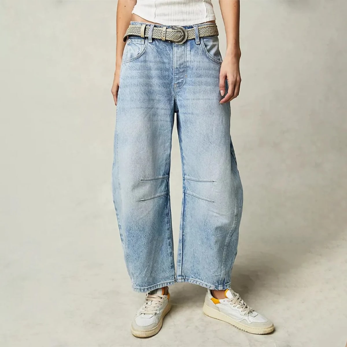 High-waisted barrel-leg jeans with seam detail.