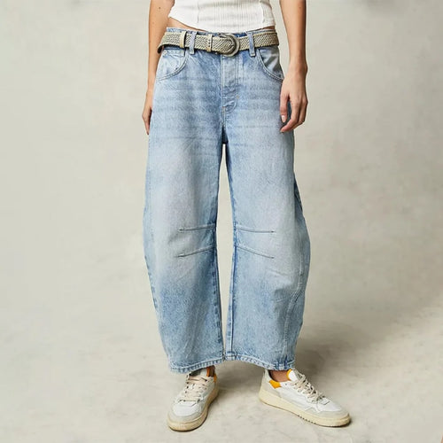 High-waisted barrel-leg jeans with seam detail.