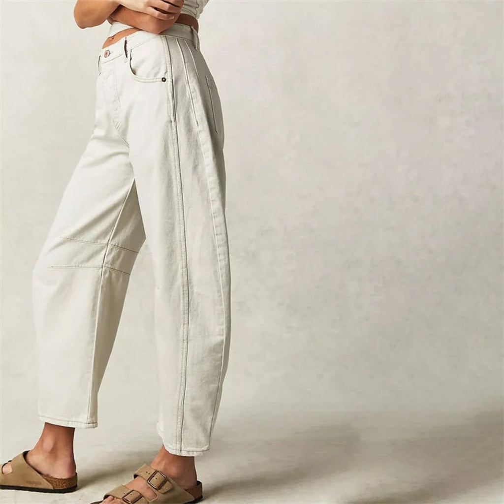High-waisted barrel-leg jeans with seam detail.