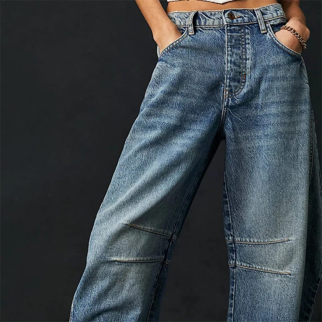 High-waisted barrel-leg jeans with seam detail.