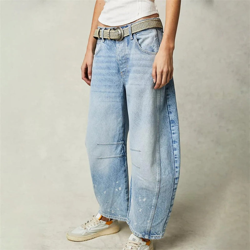 High-waisted barrel-leg jeans with seam detail.