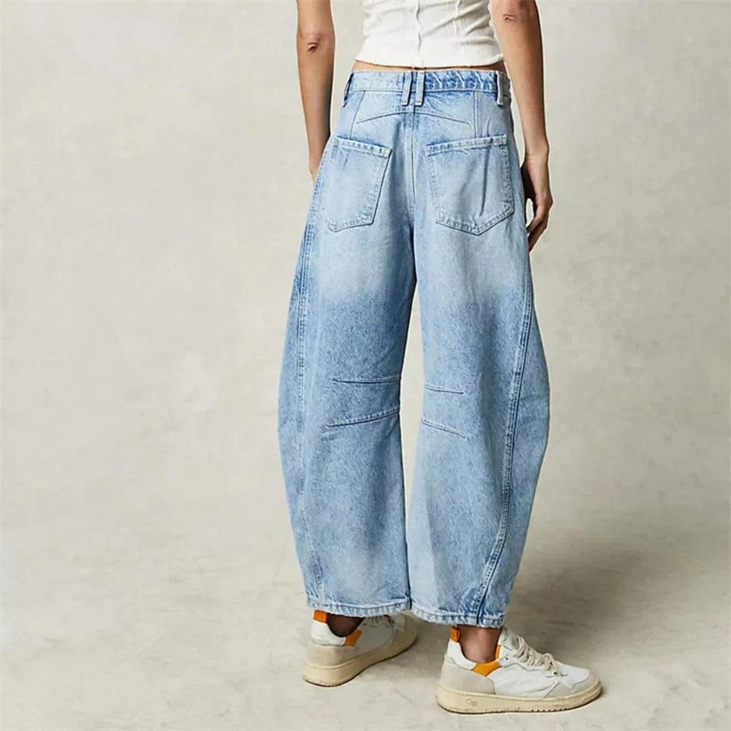 High-waisted barrel-leg jeans with seam detail.