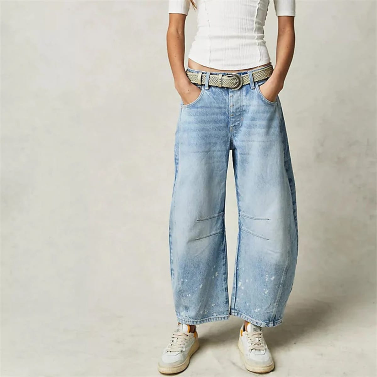 High-waisted barrel-leg jeans with seam detail.