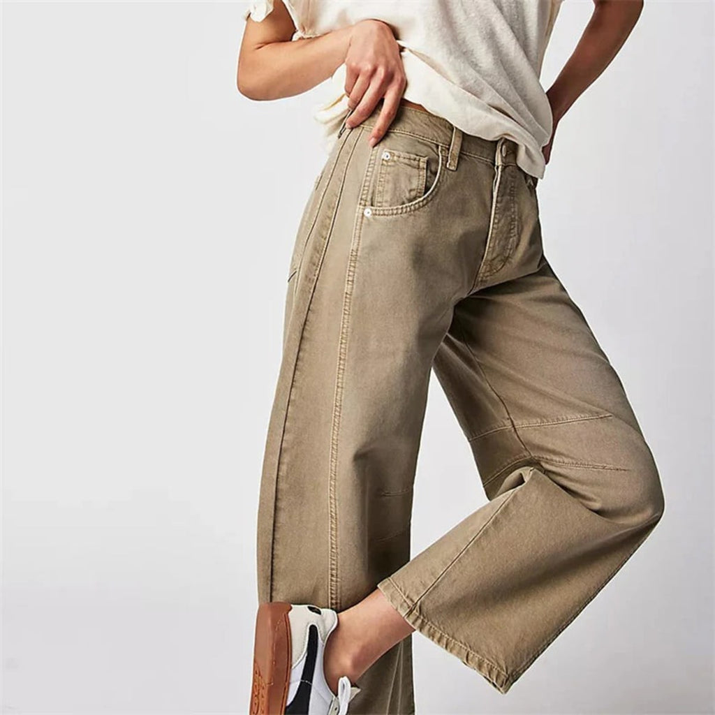 High-waisted barrel-leg jeans with seam detail.