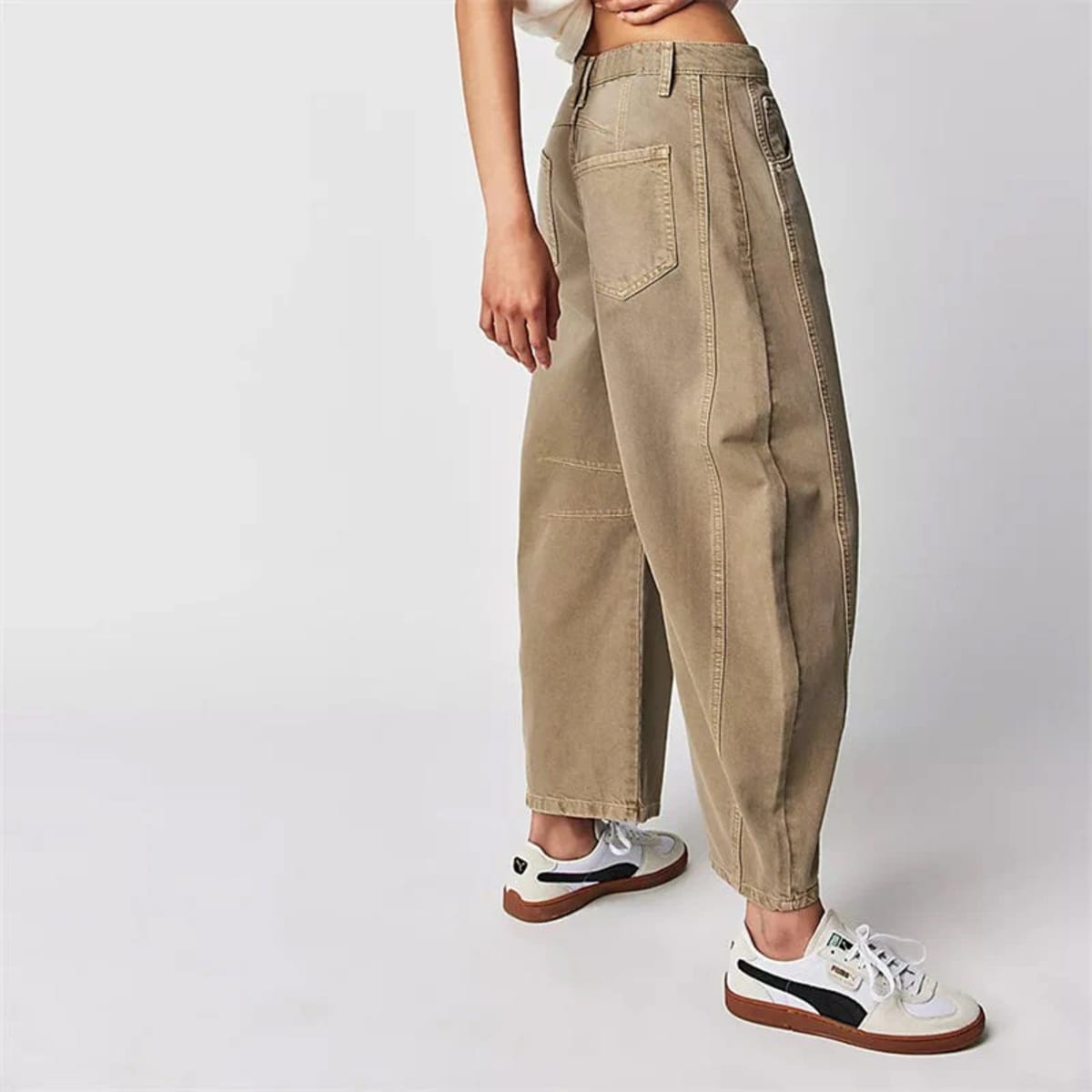 High-waisted barrel-leg jeans with seam detail.