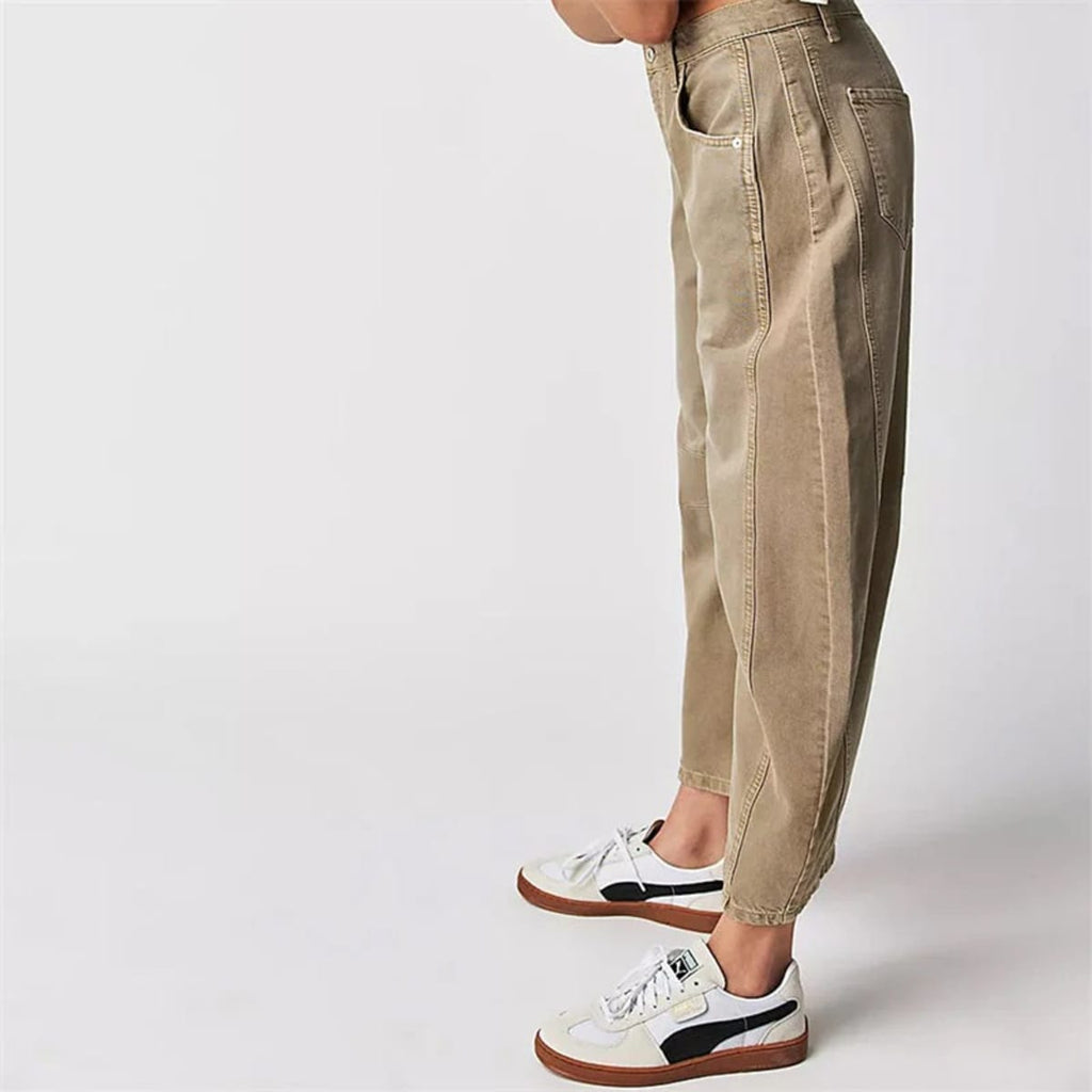 High-waisted barrel-leg jeans with seam detail.