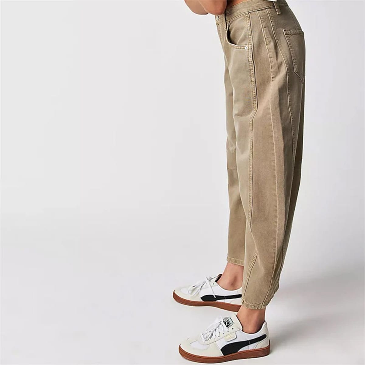 High-waisted barrel-leg jeans with seam detail.