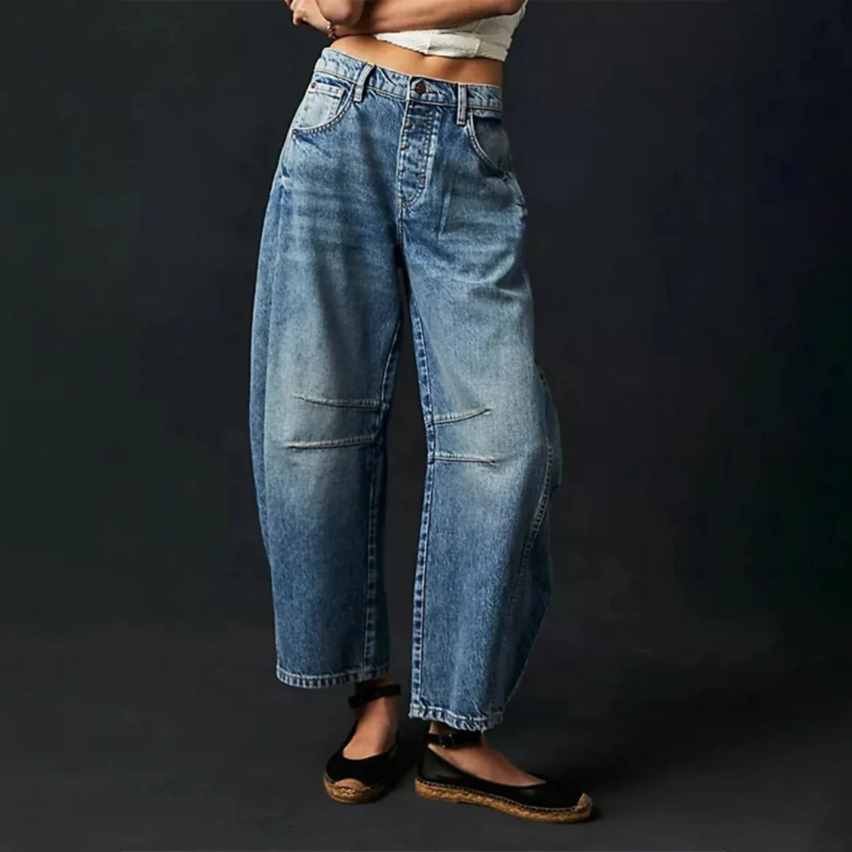 High-waisted barrel-leg jeans with seam detail.