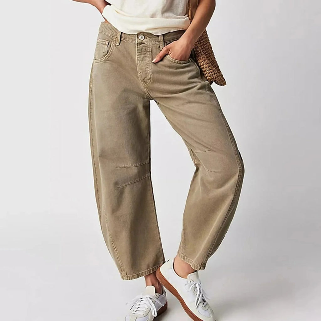 High-waisted barrel-leg jeans with seam detail.