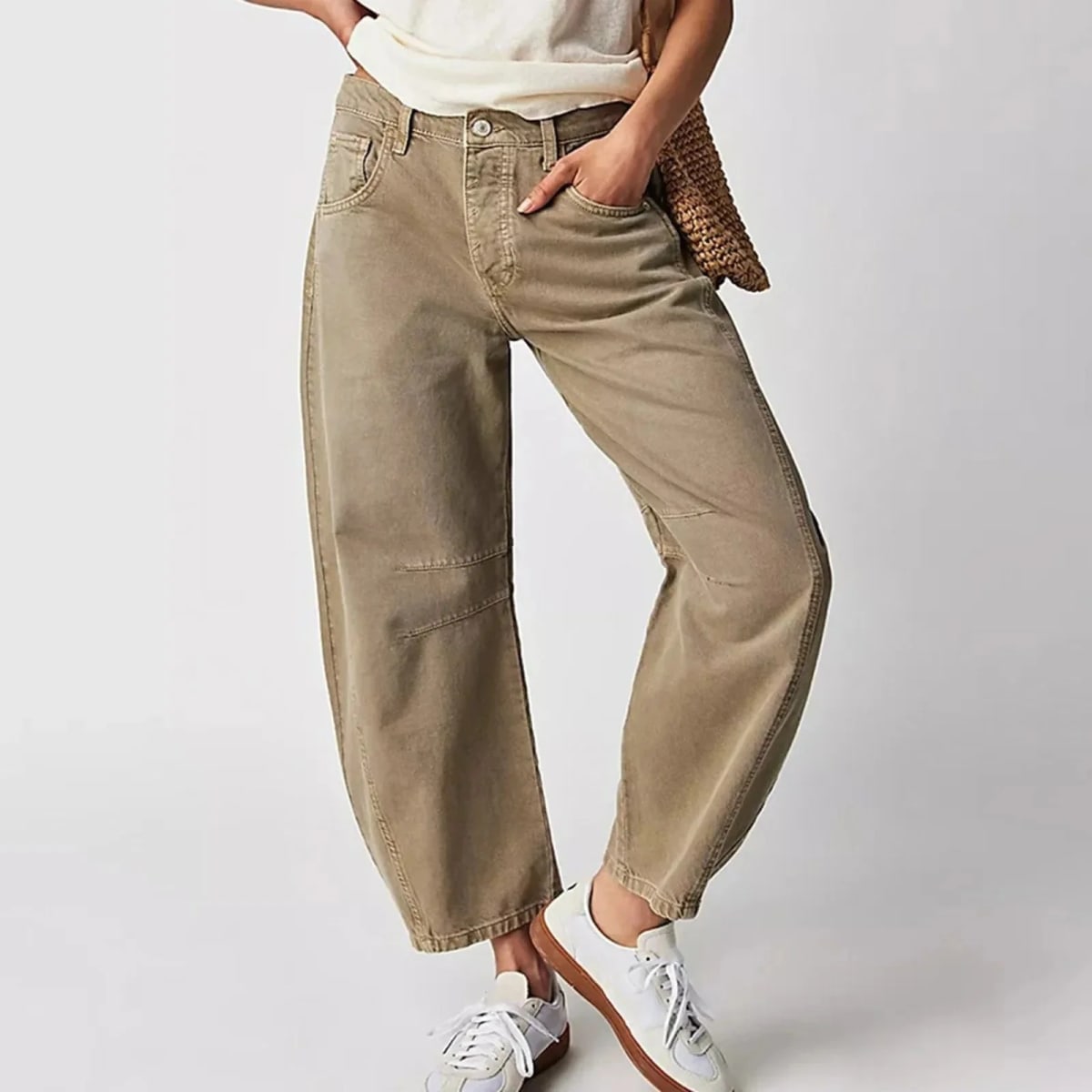 High-waisted barrel-leg jeans with seam detail.