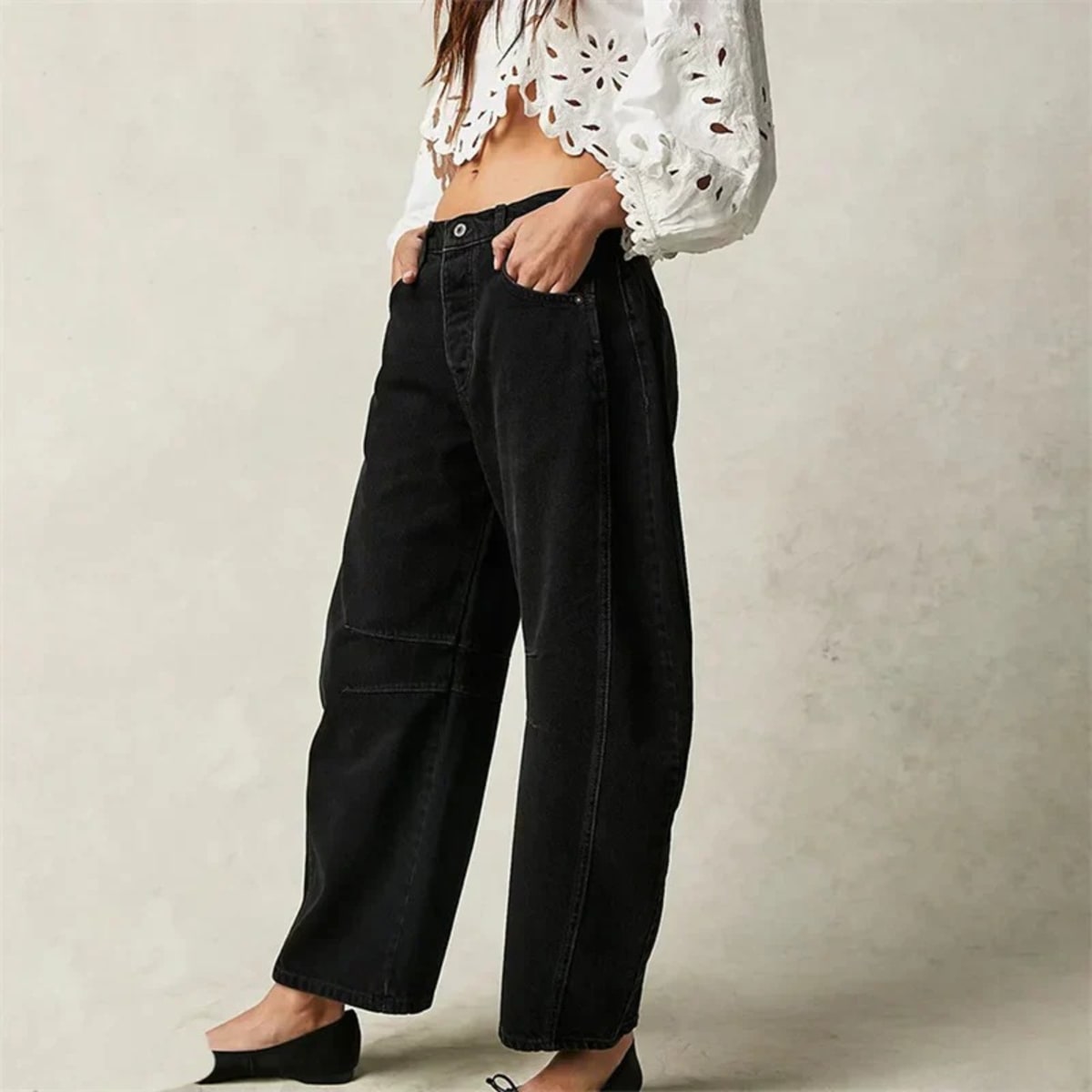 High-waisted barrel-leg jeans with seam detail.