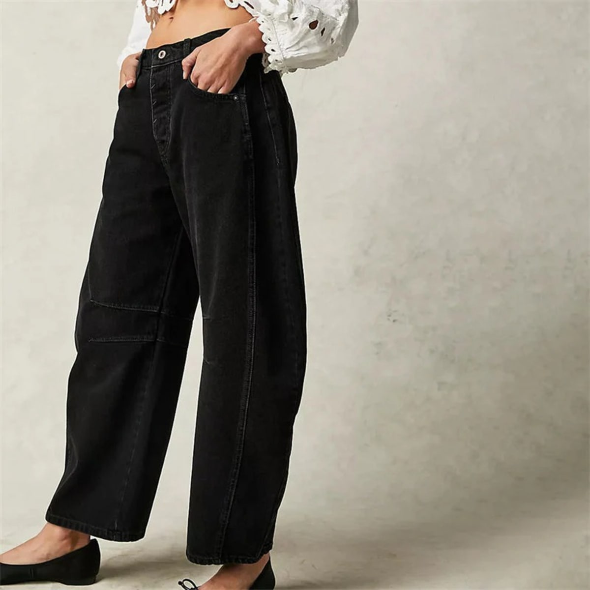 High-waisted barrel-leg jeans with seam detail.