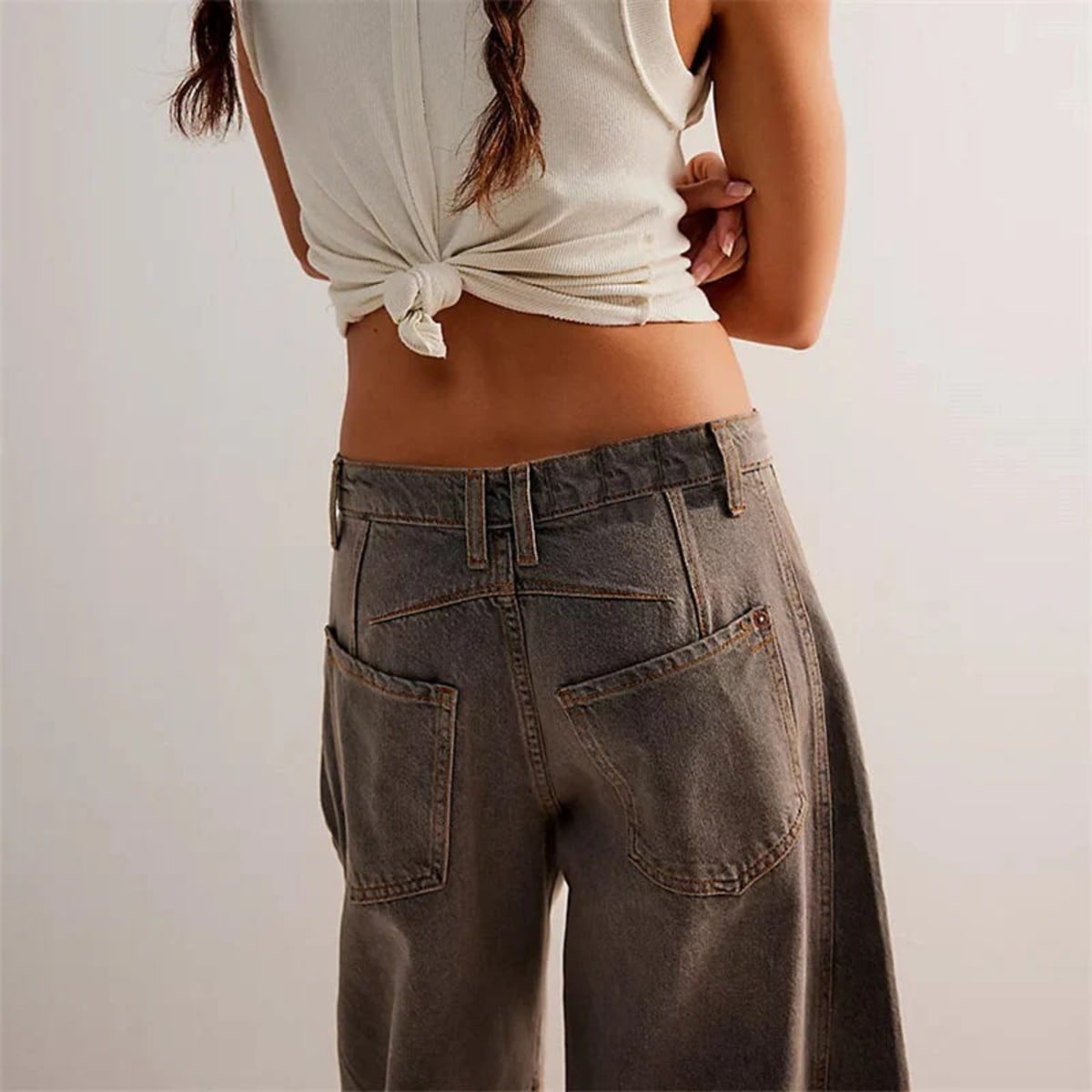 High-waisted barrel-leg jeans with seam detail.