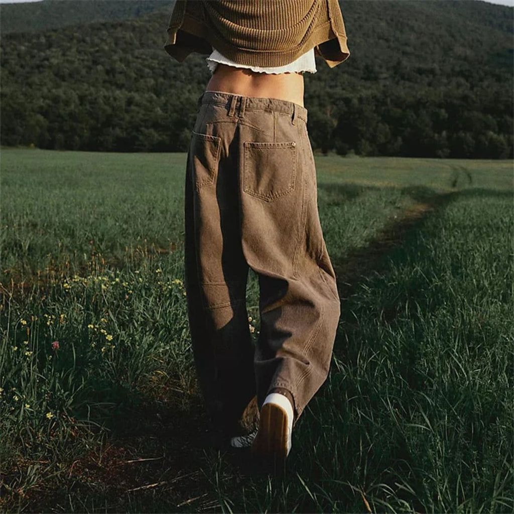 High-waisted barrel-leg jeans with seam detail.