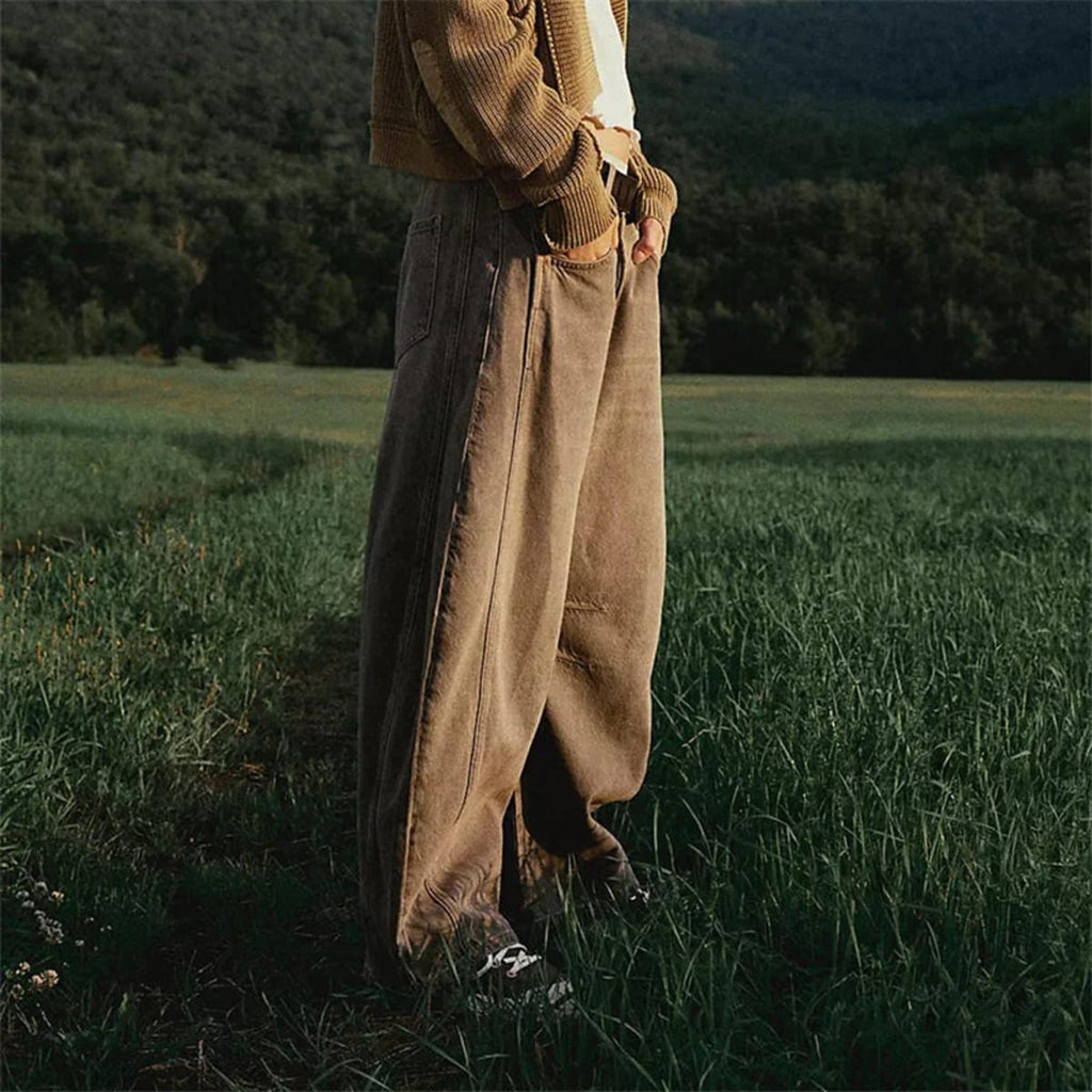 High-waisted barrel-leg jeans with seam detail.