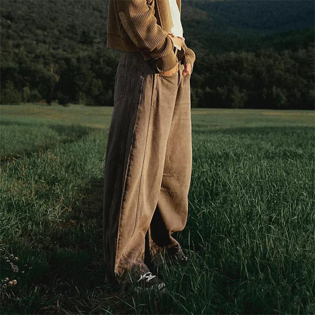 High-waisted barrel-leg jeans with seam detail.
