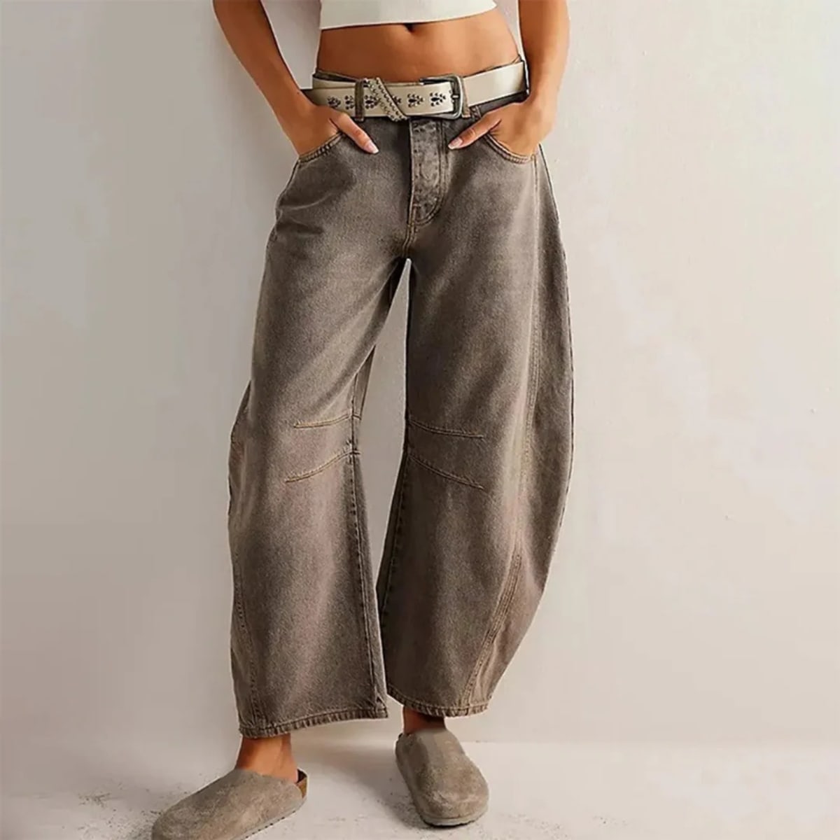 High-waisted barrel-leg jeans with seam detail.