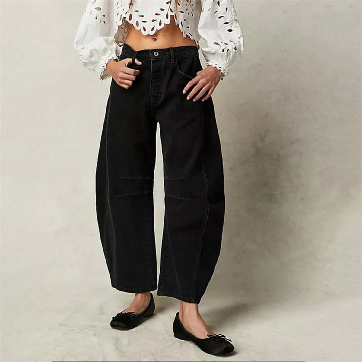 High-waisted barrel-leg jeans with seam detail.