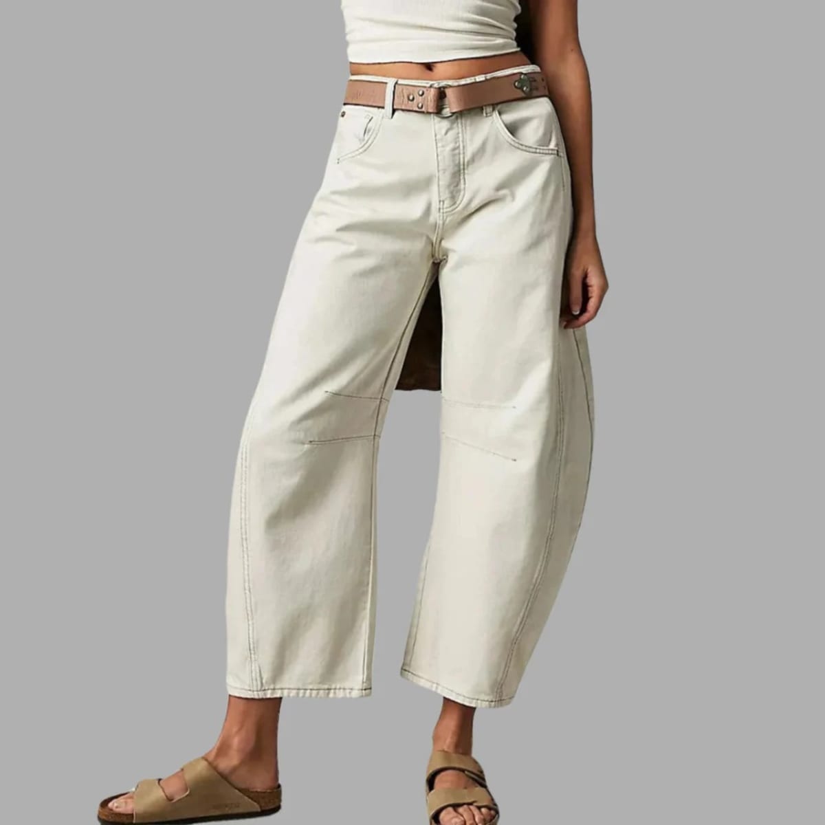 High-waisted barrel-leg jeans with seam detail.