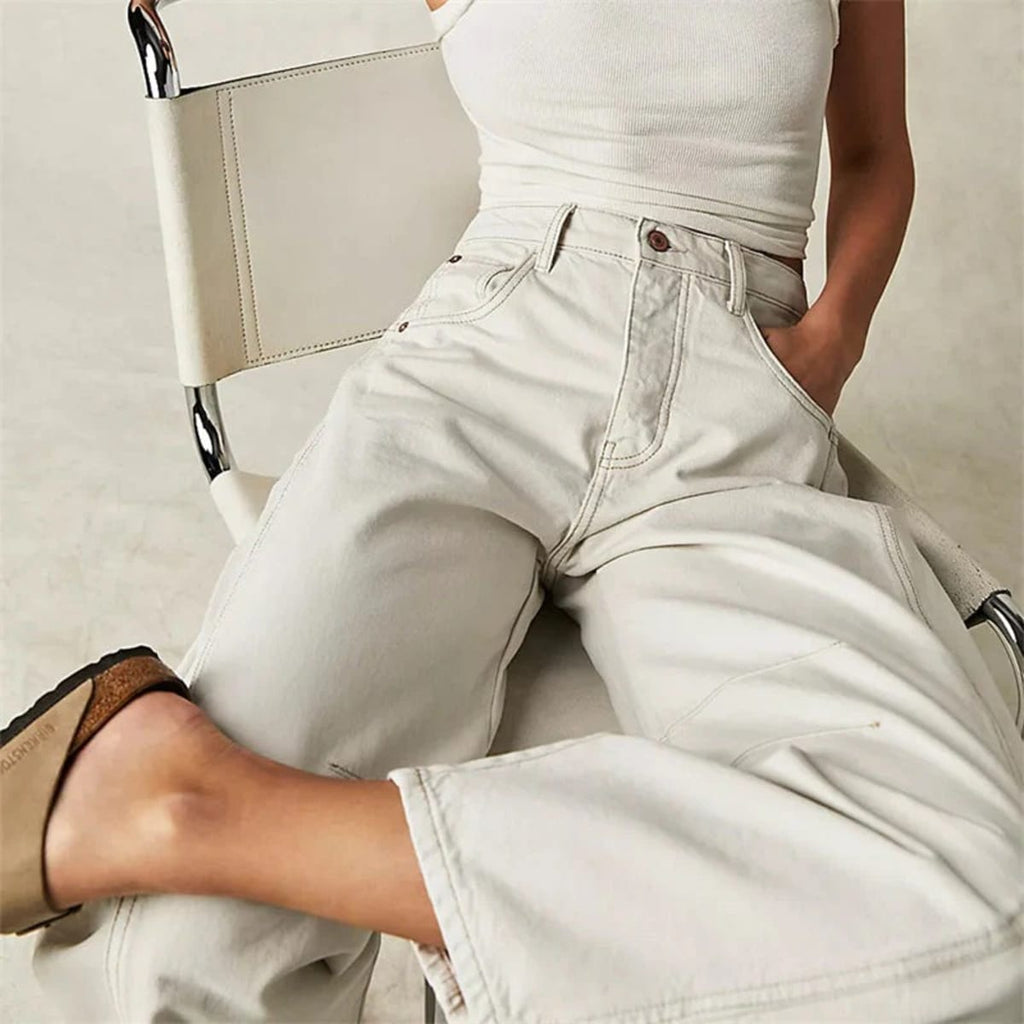 High-waisted barrel-leg jeans with seam detail.