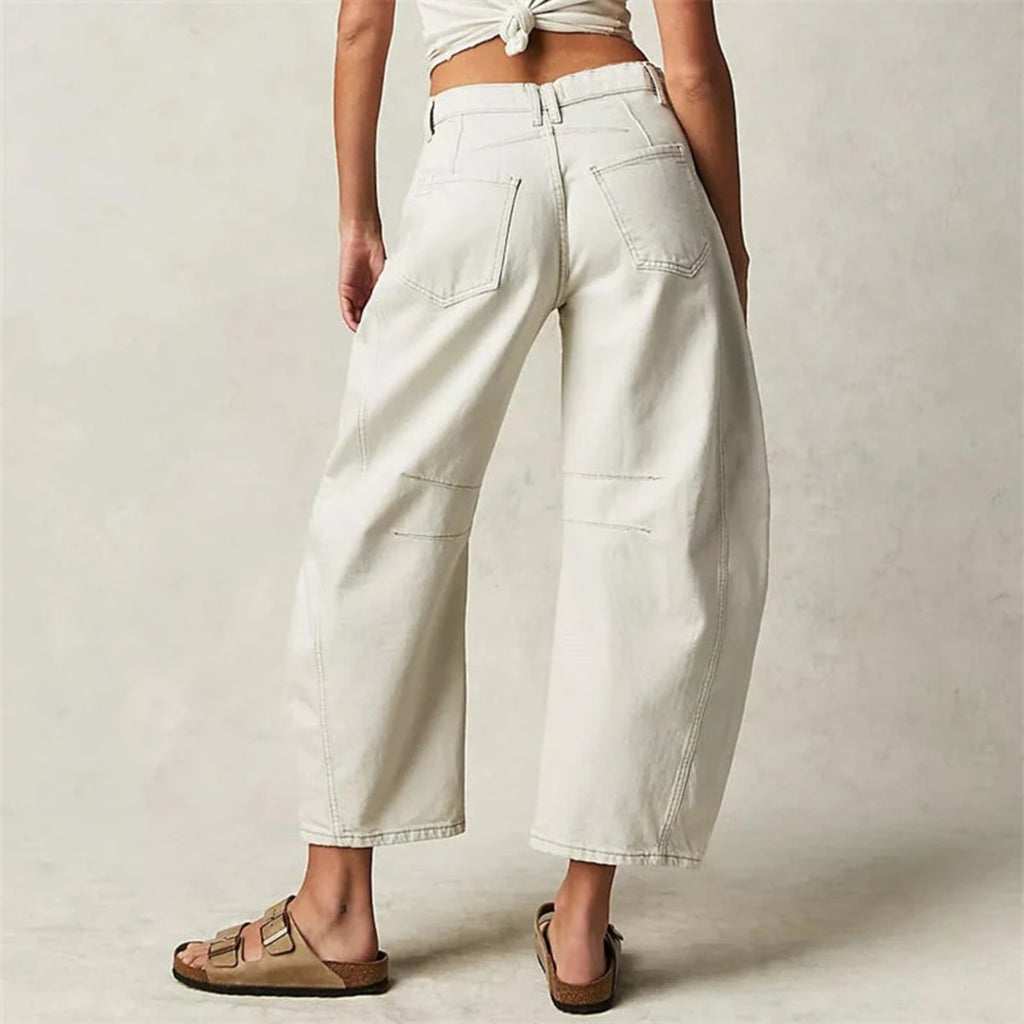 High-waisted barrel-leg jeans with seam detail.