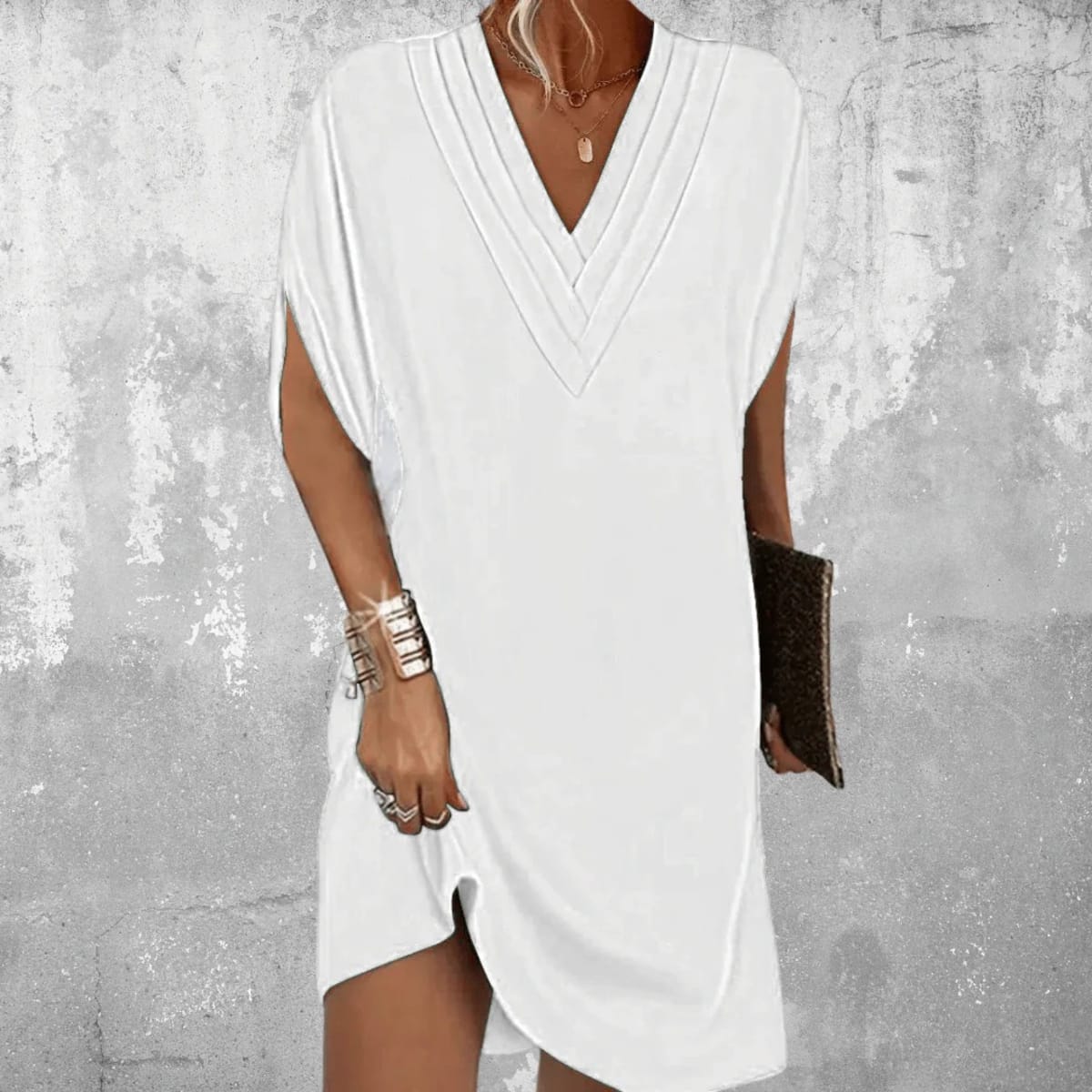 Dress with V-neckline and cutout sleeves, draped fit.