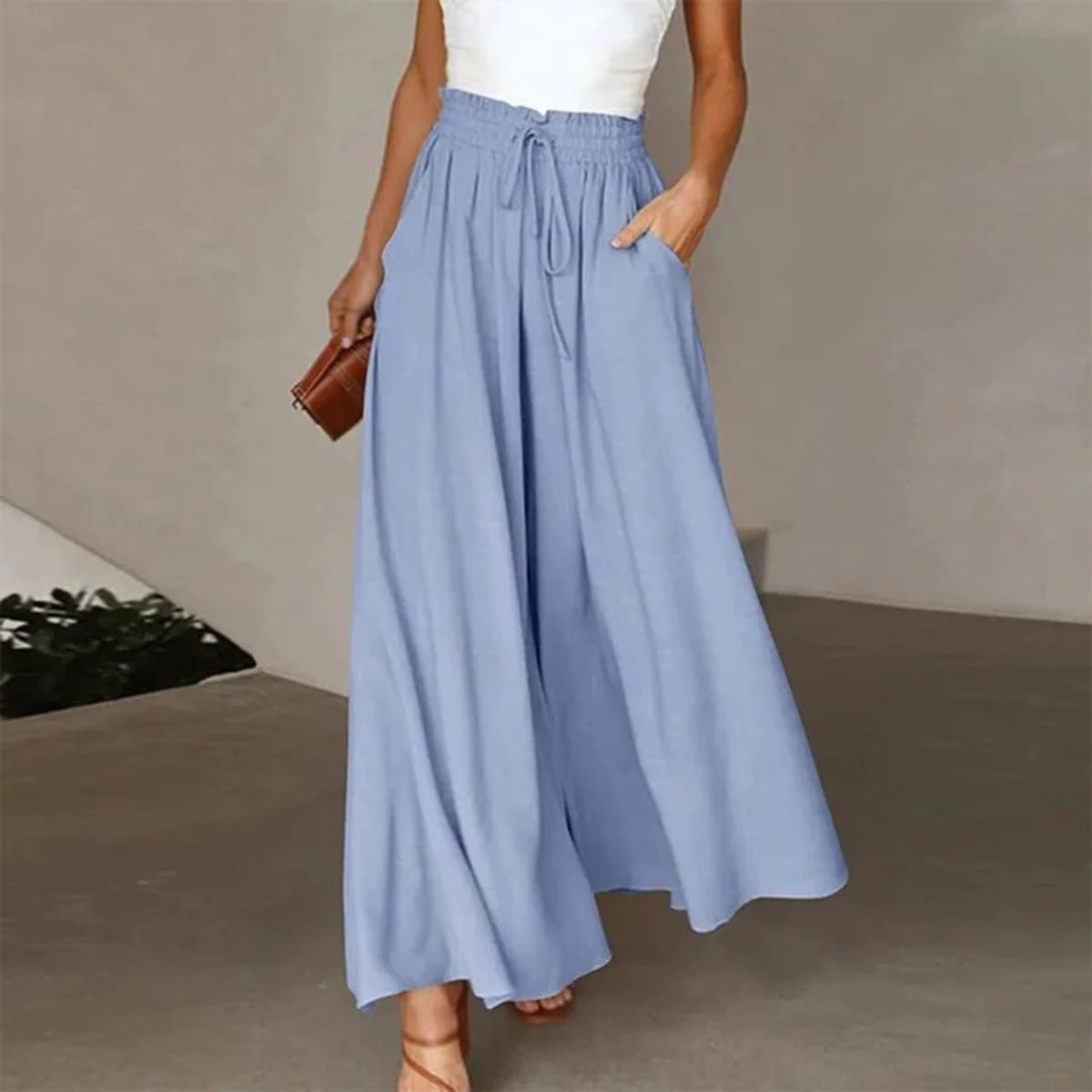 High-waisted wide-leg palazzo pants with drawstring waist.