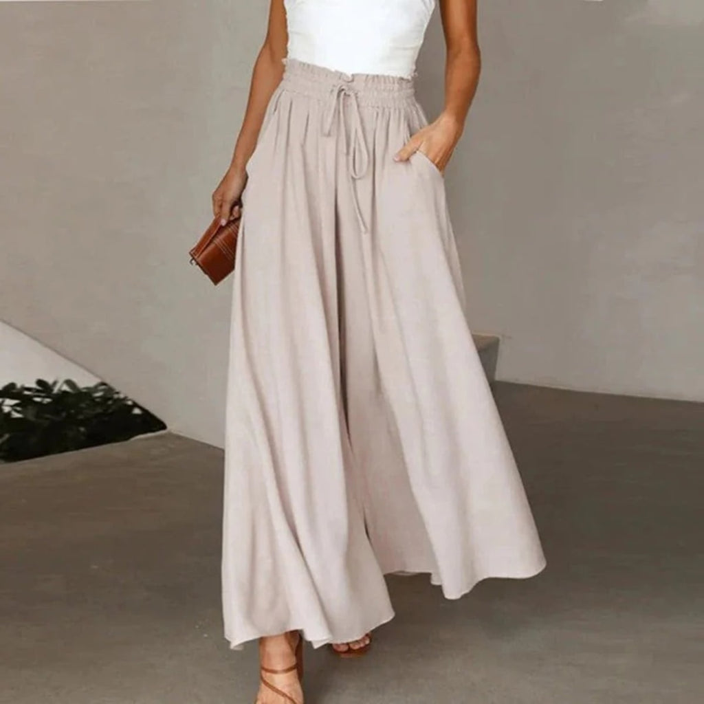 High-waisted wide-leg palazzo pants with drawstring waist.