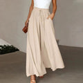 High-waisted wide-leg palazzo pants with drawstring waist.