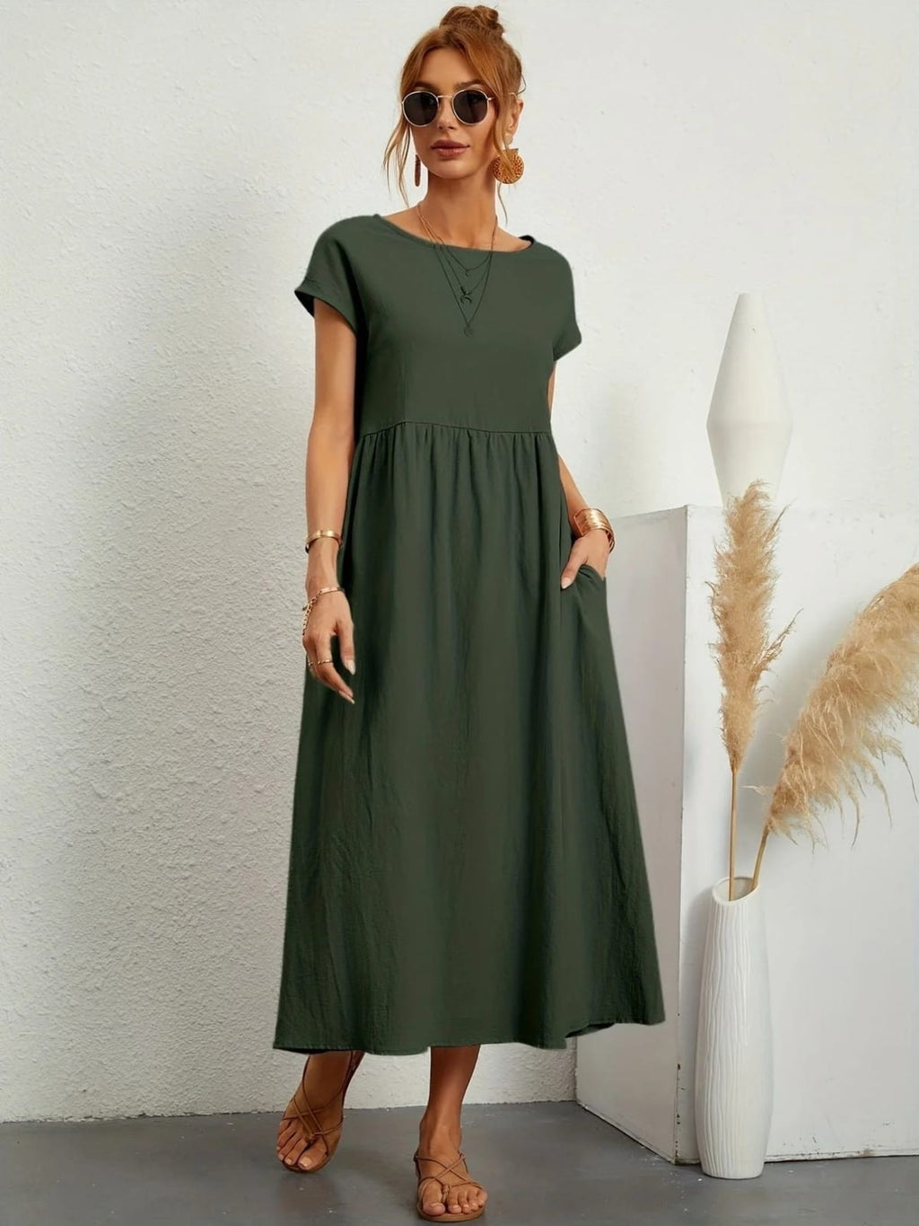 Lightweight dress with flowing silhouette and refined neckline.