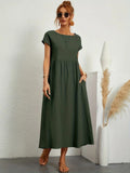 Lightweight dress with flowing silhouette and refined neckline.