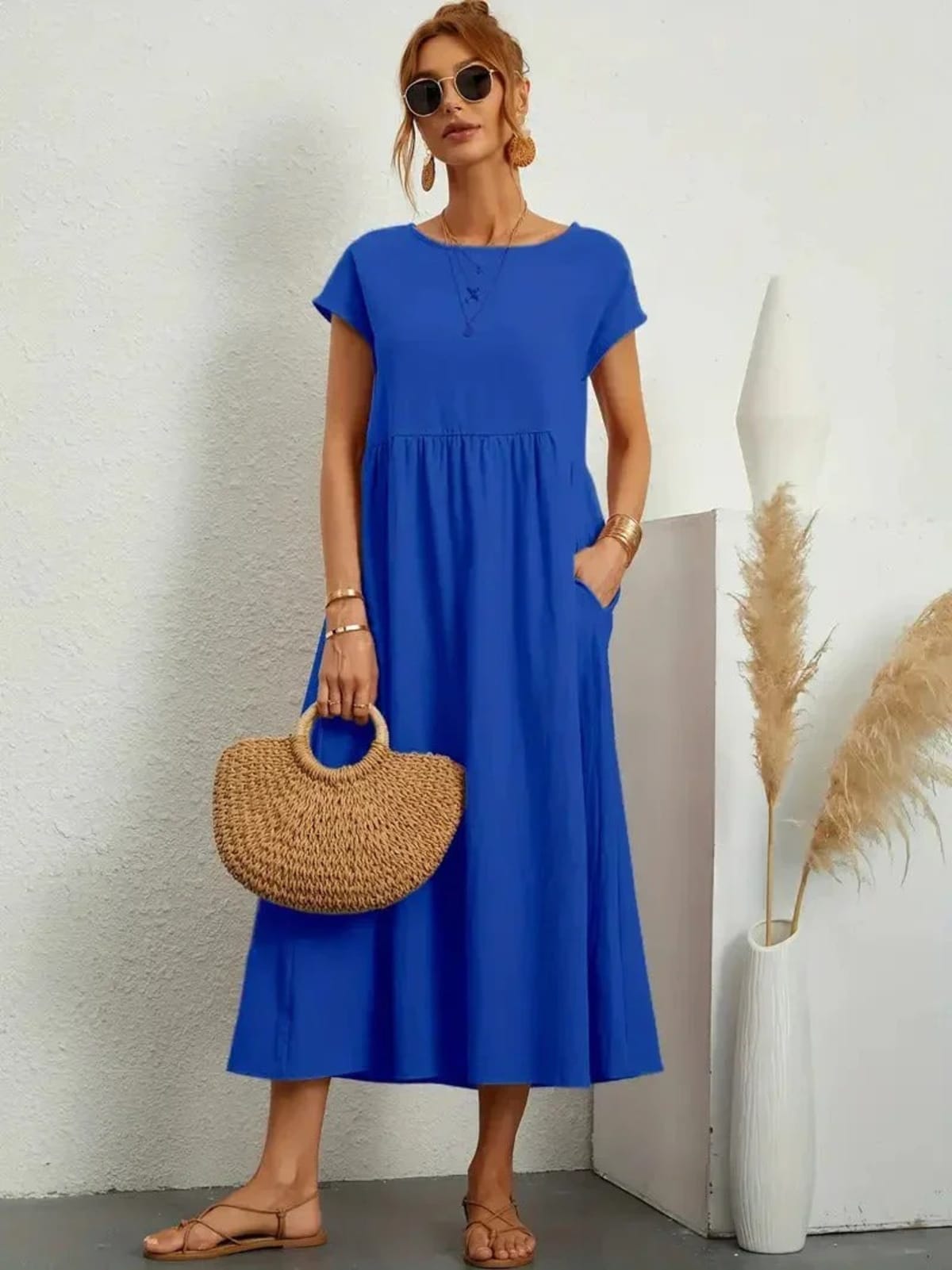 Lightweight dress with flowing silhouette and refined neckline.