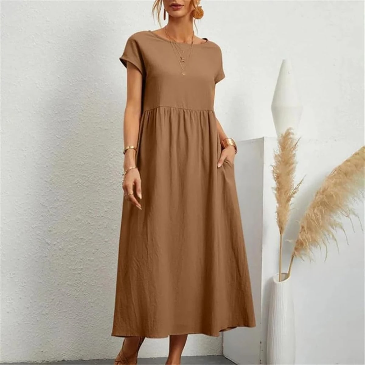 Lightweight dress with flowing silhouette and refined neckline.