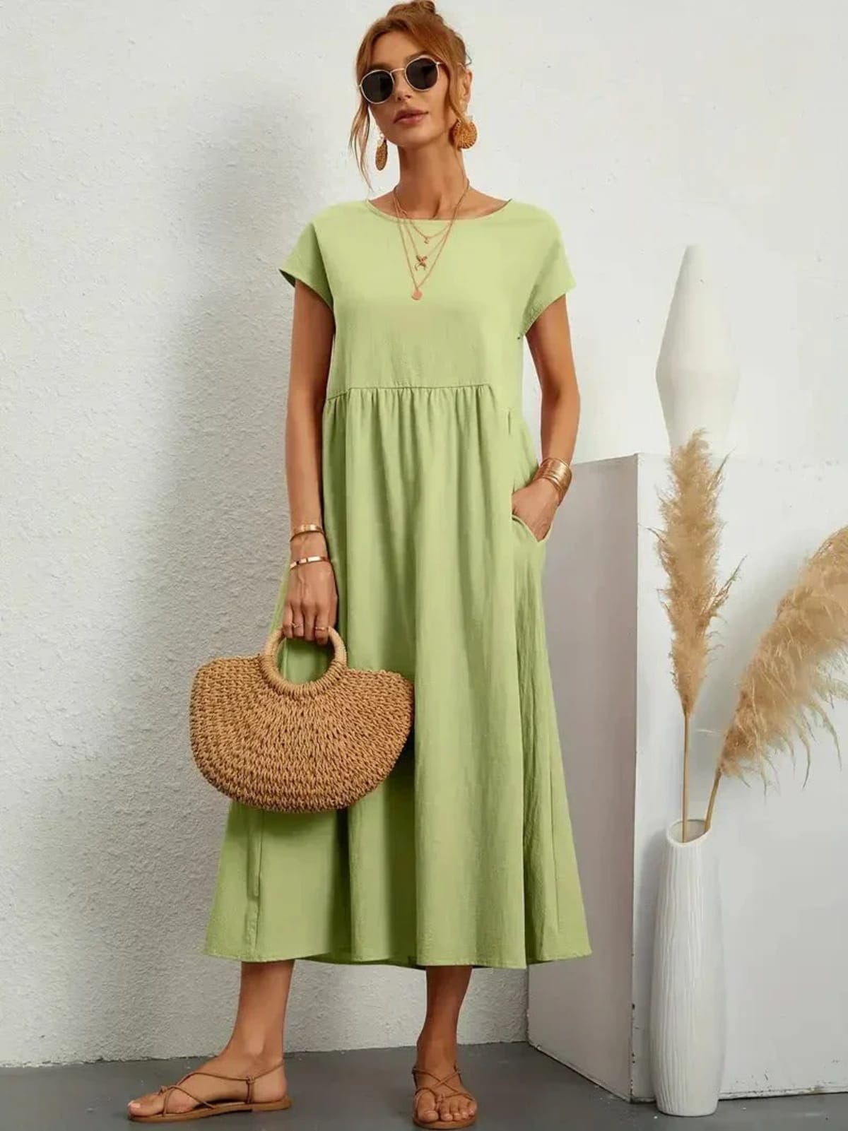 Lightweight dress with flowing silhouette and refined neckline.