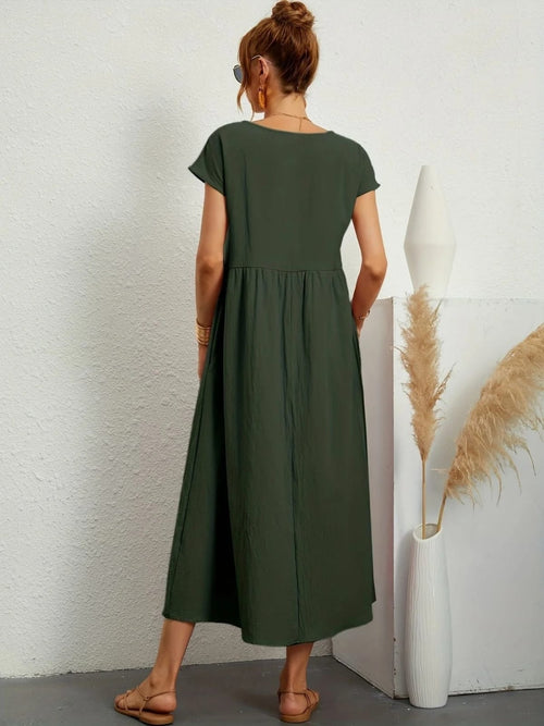 Lightweight dress with flowing silhouette and refined neckline.