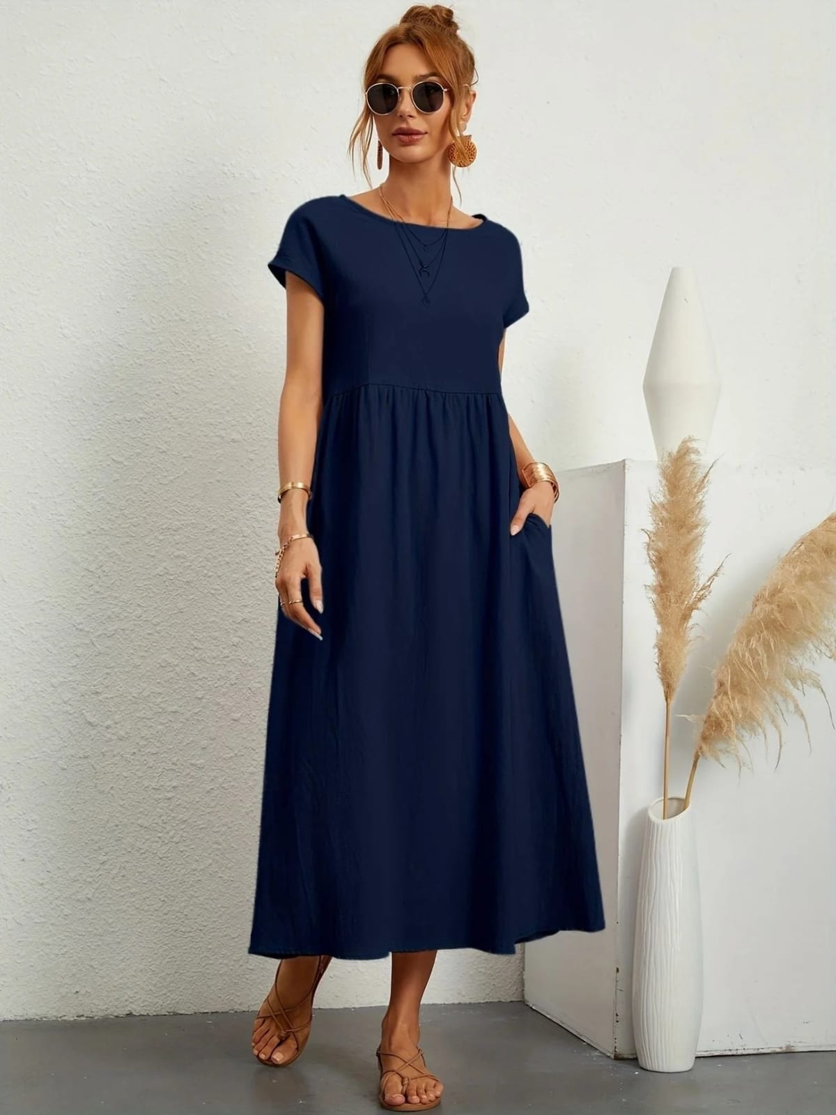 Lightweight dress with flowing silhouette and refined neckline.
