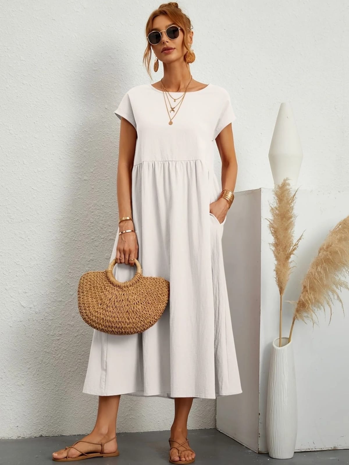 Lightweight dress with flowing silhouette and refined neckline.