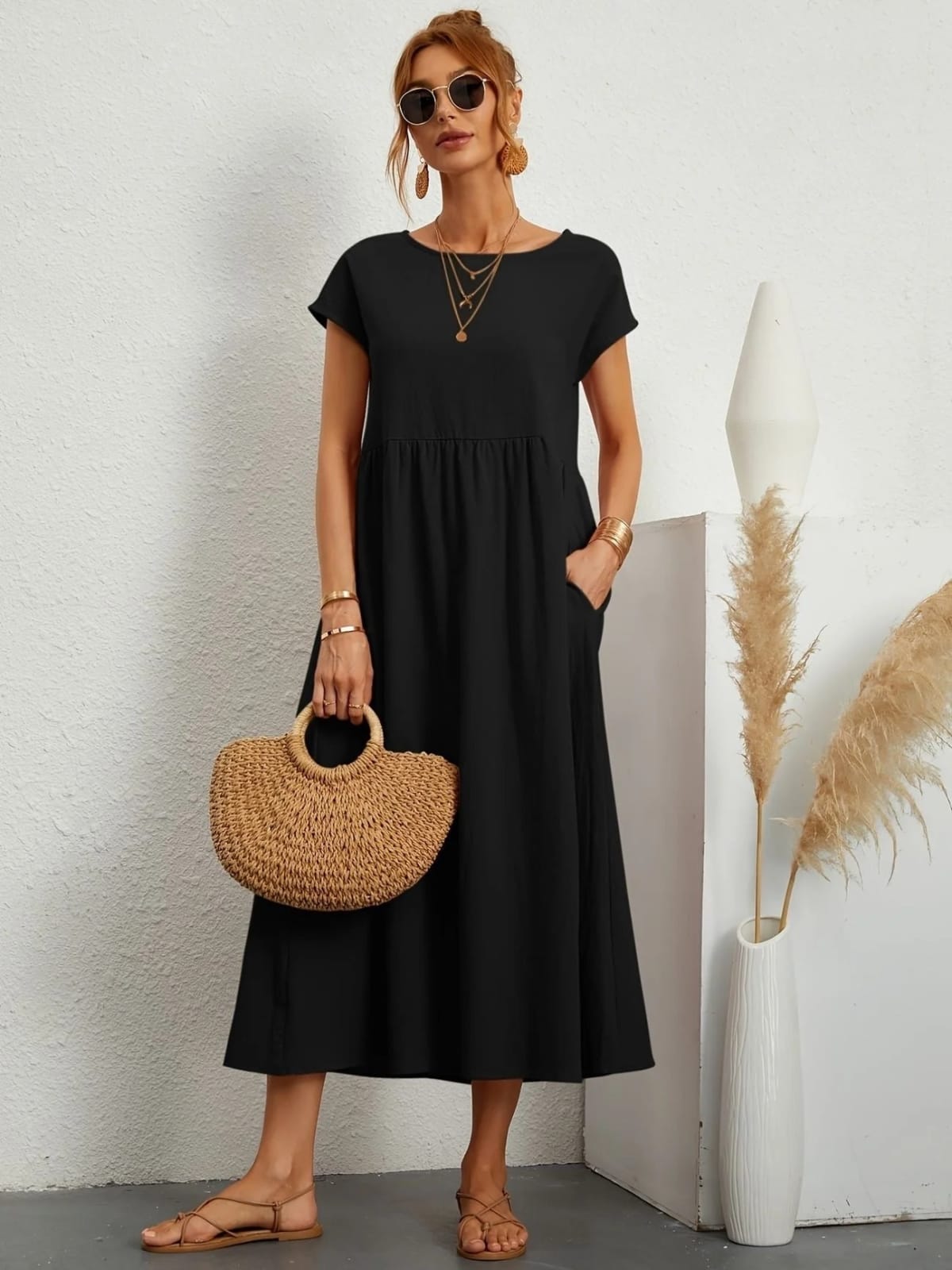 Lightweight dress with flowing silhouette and refined neckline.