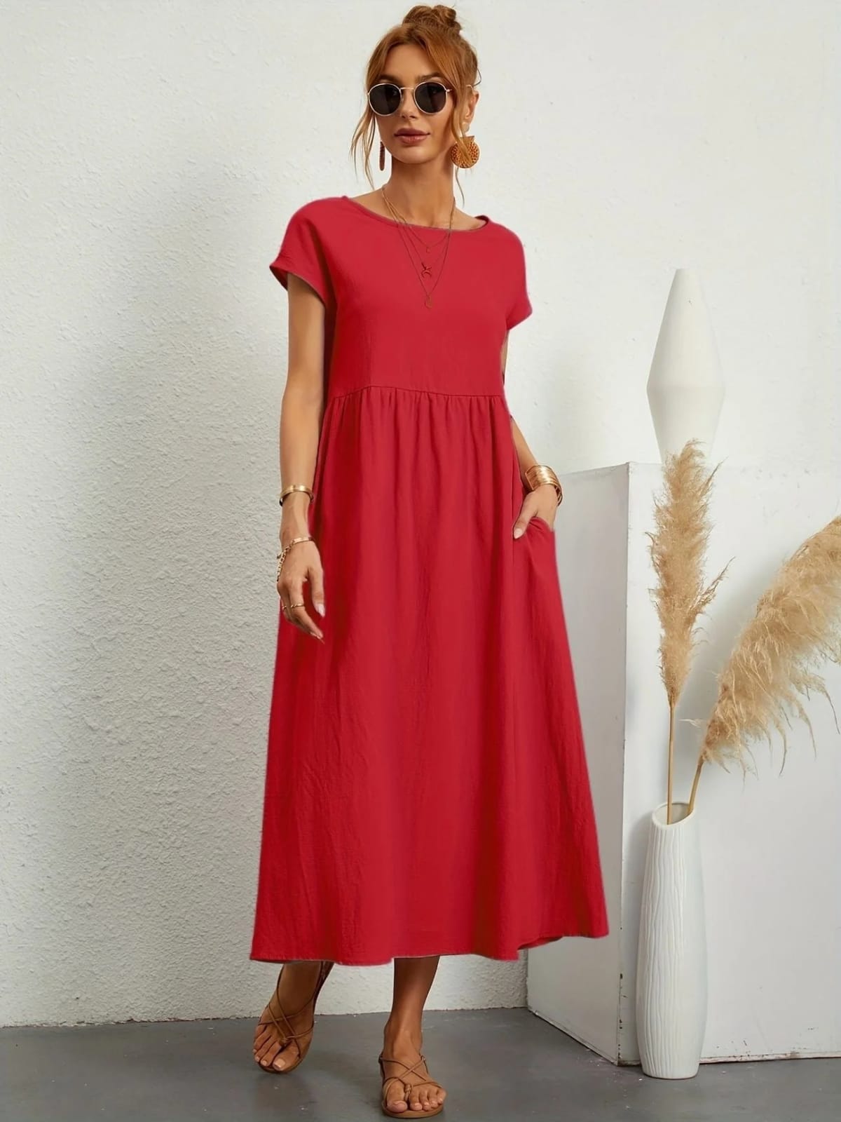 Lightweight dress with flowing silhouette and refined neckline.