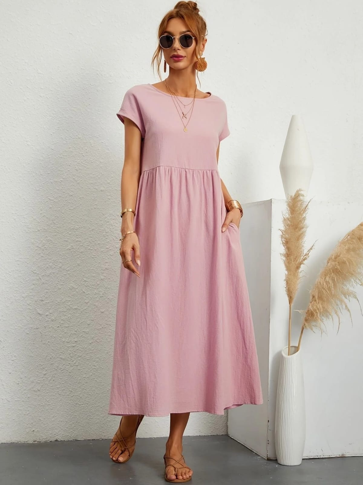 Lightweight dress with flowing silhouette and refined neckline.