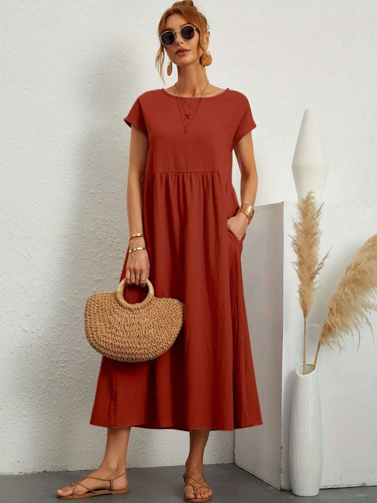Lightweight dress with flowing silhouette and refined neckline.