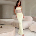 Long dress with lace panel and tied straps, elegant fit.