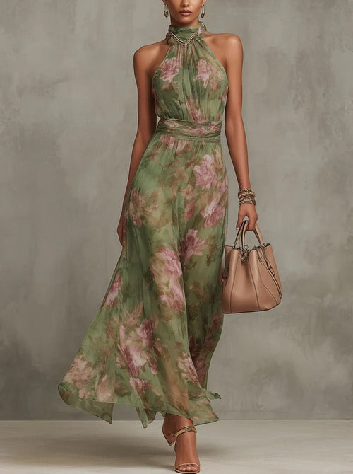 Woman in halter maxi dress with pleated bodice and waist tie