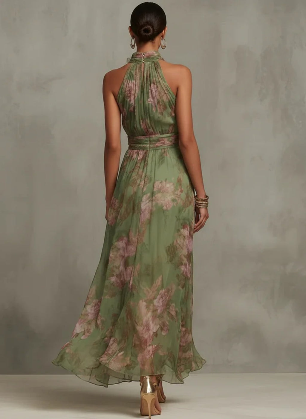 Woman in halter maxi dress with pleated bodice and waist tie