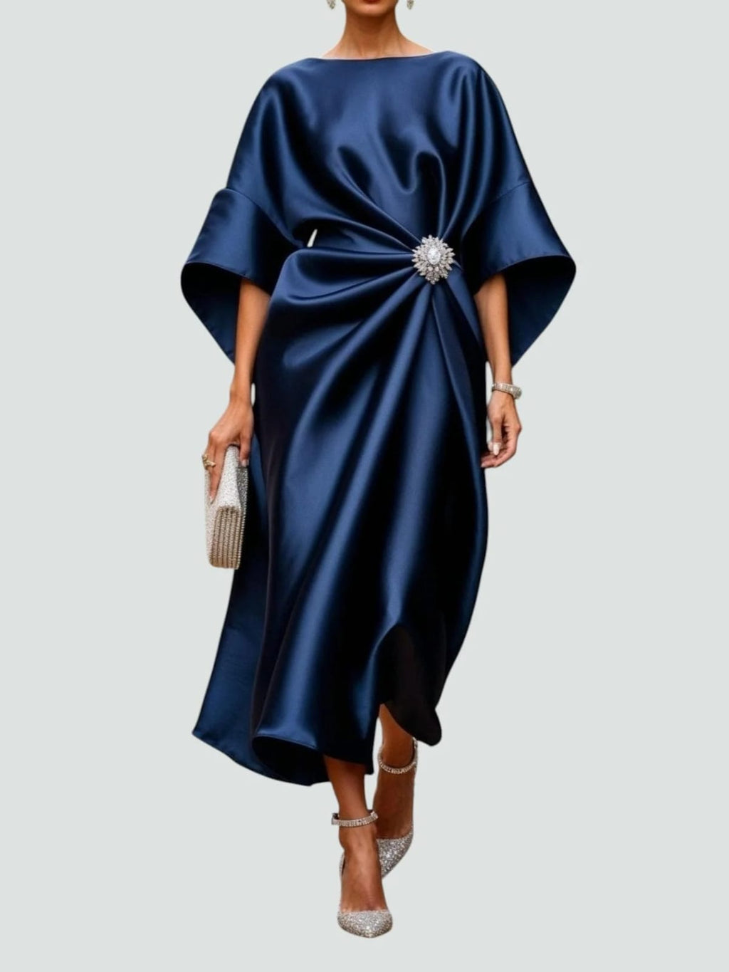 Long elegant dress with refined sheen, flattering silhouette.