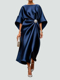 Long elegant dress with refined sheen, flattering silhouette.