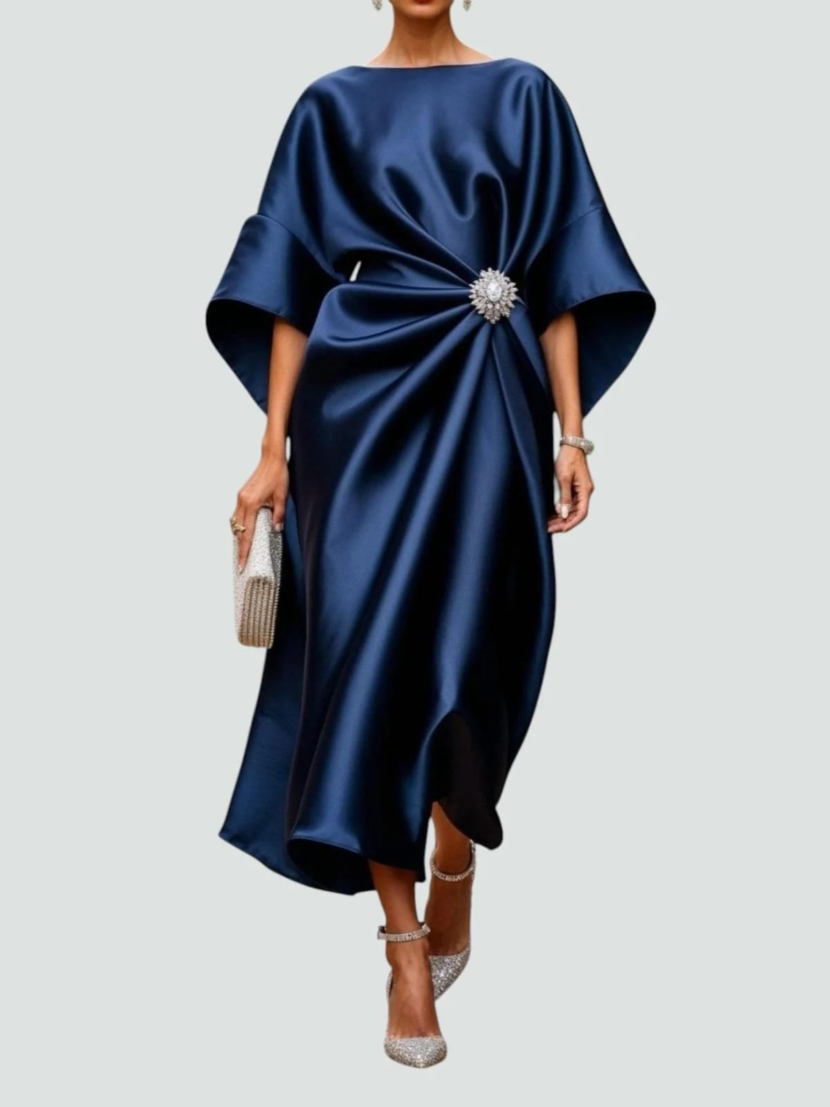 Long elegant dress with refined sheen, flattering silhouette.