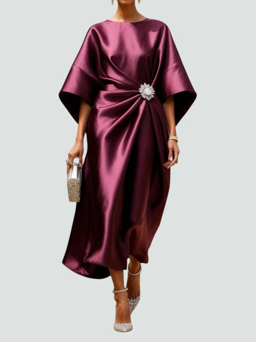 Long elegant dress with refined sheen, flattering silhouette.