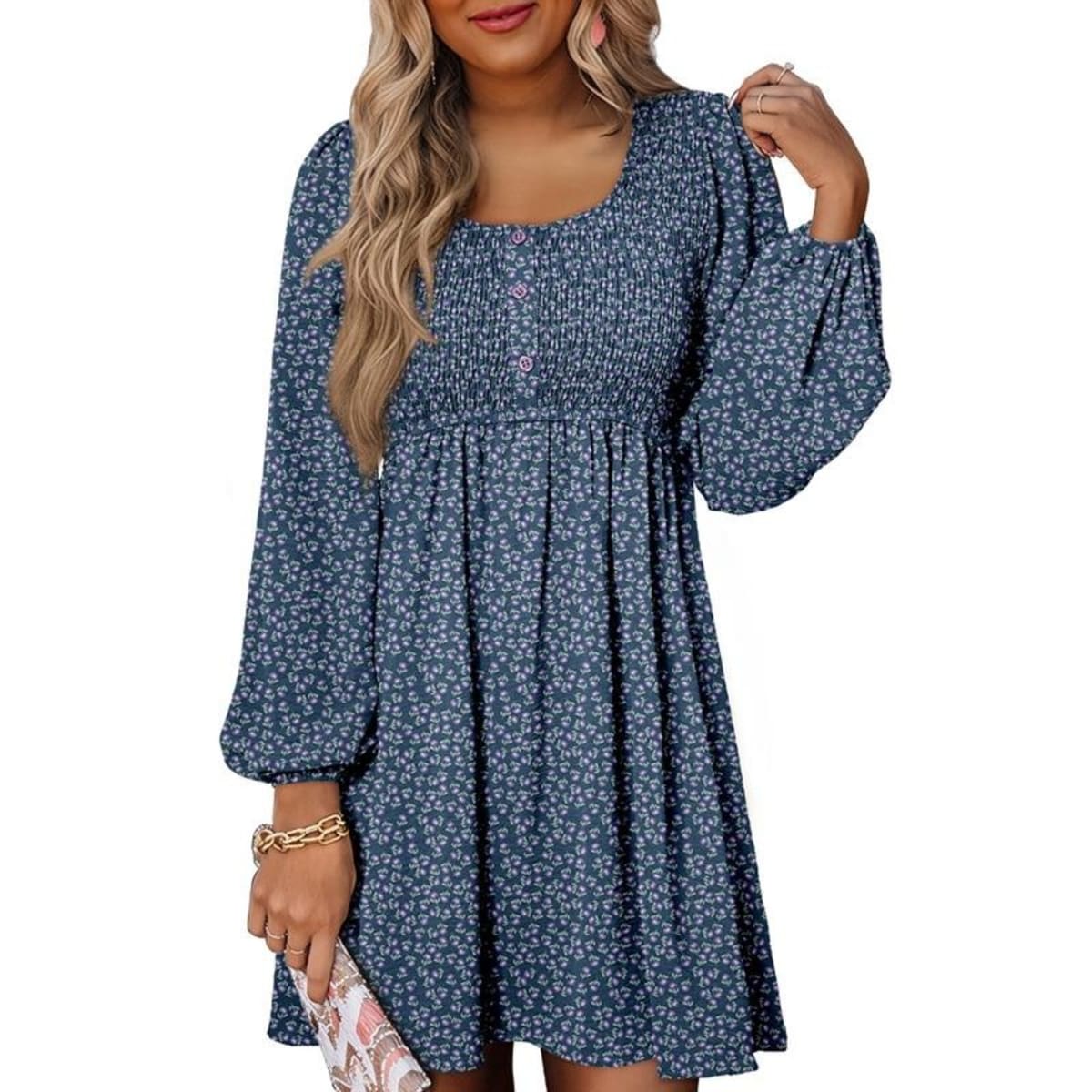 Women's smocked empire waist mini dress with long sleeves and buttons.