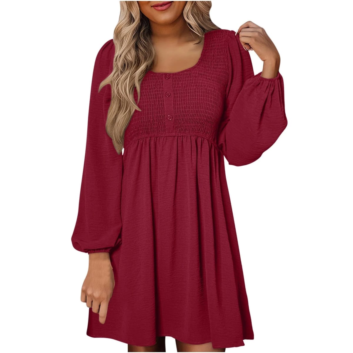 Women's smocked empire waist mini dress with long sleeves and buttons.
